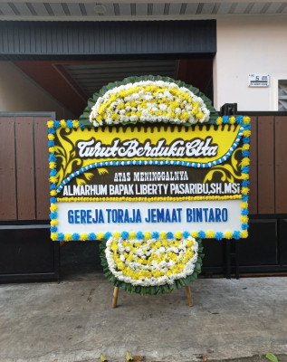 Papan Bunga Duka di Bandar Pulau